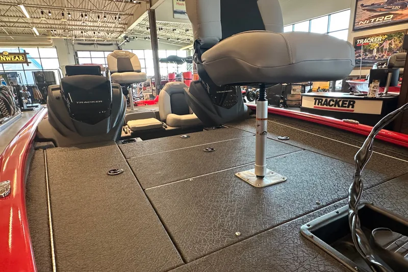 Slide: The Image of 2027 Tracker Pro Team 195 boat interior with seating and storage compartments. - 42