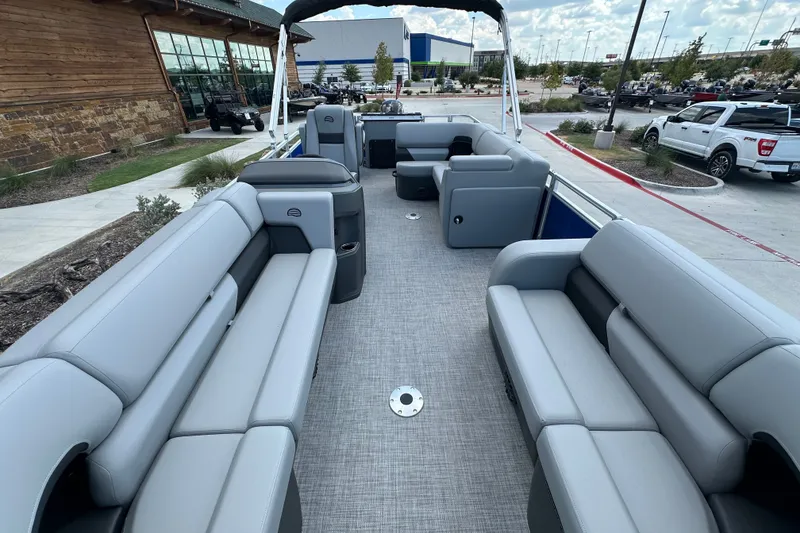 Slide: The Image of 2027 Sun Tracker SportFish 22 DLX pontoon boat with spacious seating and modern design. - 15