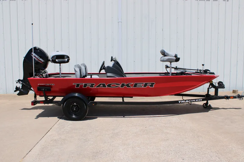The Image of 2027 Tracker Pro 170 boat, red exterior, on trailer, side view. - 0