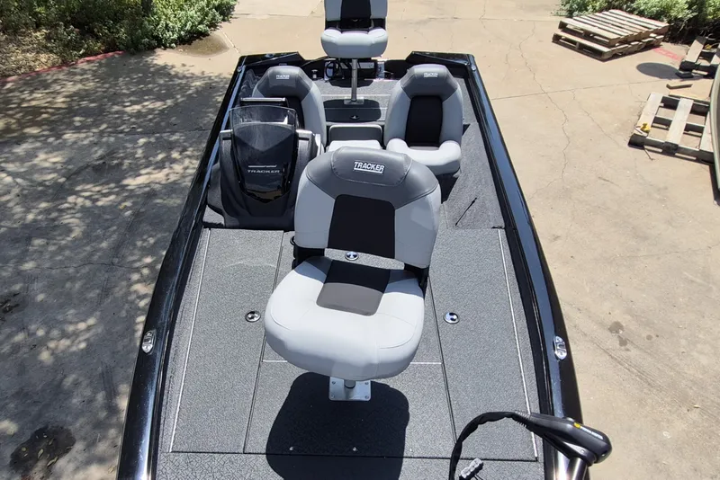 Slide: The Image of 2027 Tracker Pro Team 190 boat with gray seating and sleek design. - 13