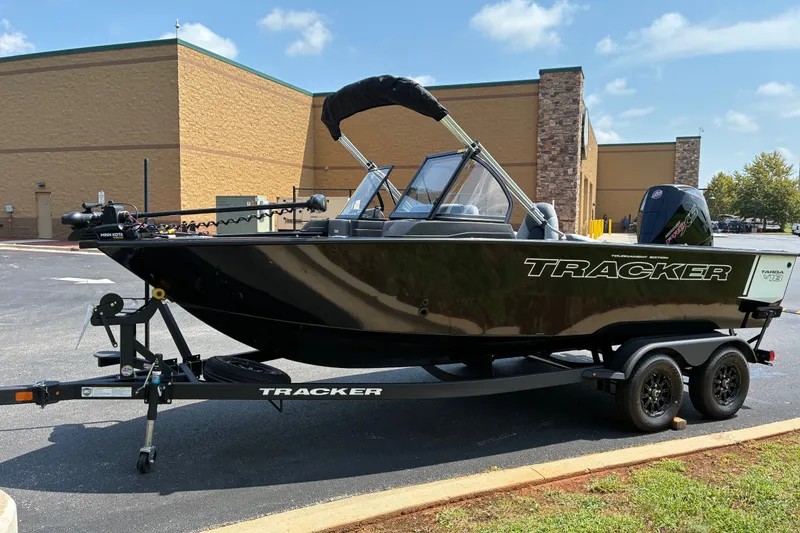 The Image of 2027 Tracker Targa V-18 Combo boat on trailer, parked outdoors. - 0