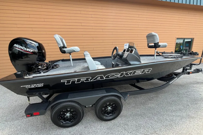 The Image of 2027 Tracker Pro Team 195 fishing boat with Mercury engine, parked on trailer. - 0