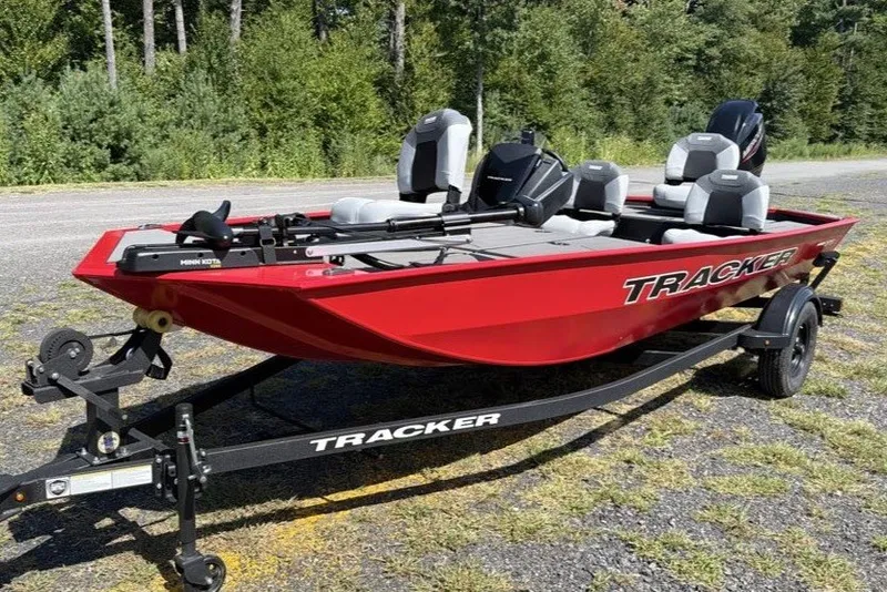 The Image of Red 2027 Tracker Pro 170 fishing boat on trailer, parked outdoors. - 0