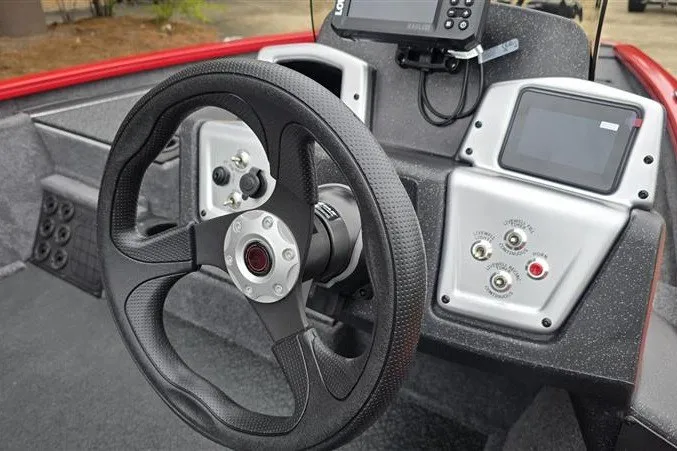 Slide: The Image of Steering console of 2027 Tracker Pro Team 195 boat with modern controls and displays. - 13