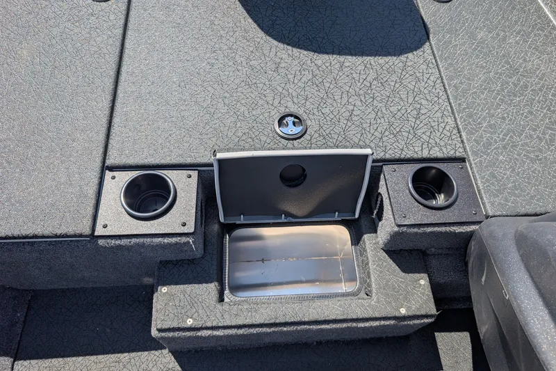 Slide: The Image of 2027 Tracker Pro Team 190 boat interior with cup holders and storage compartment. - 14