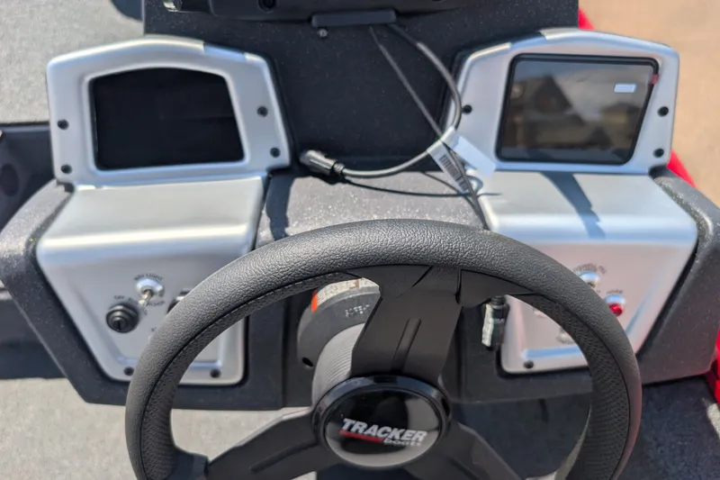 Slide: The Image of Steering console of 2027 Tracker Pro Team 190 boat with dual displays. - 13