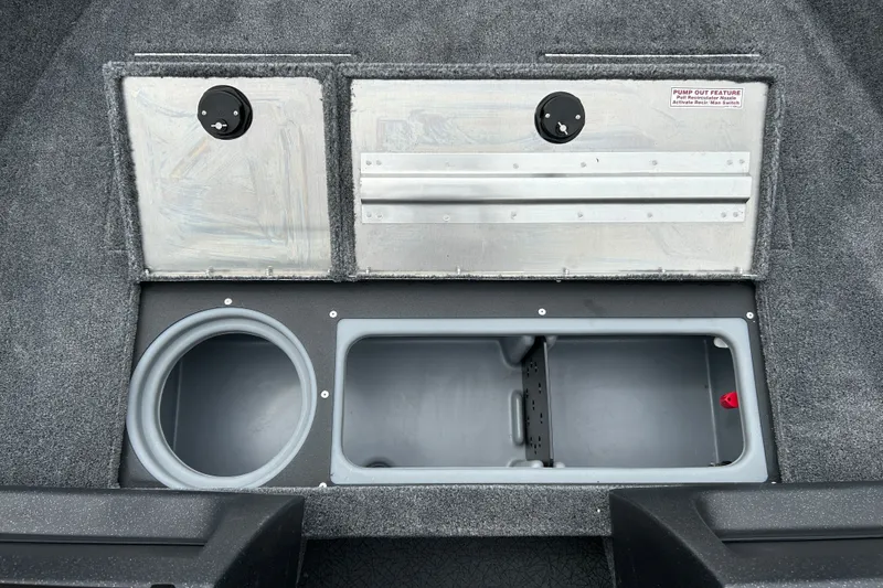 Slide: The Image of 2027 Tracker Pro Guide V-16 WT boat storage compartments with pump-out feature. - 14
