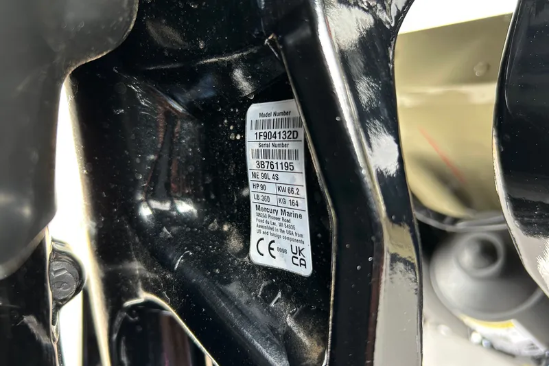 Slide: The Image of Close-up of a 2027 Tracker Pro Guide V-16 WT model number label. - 66