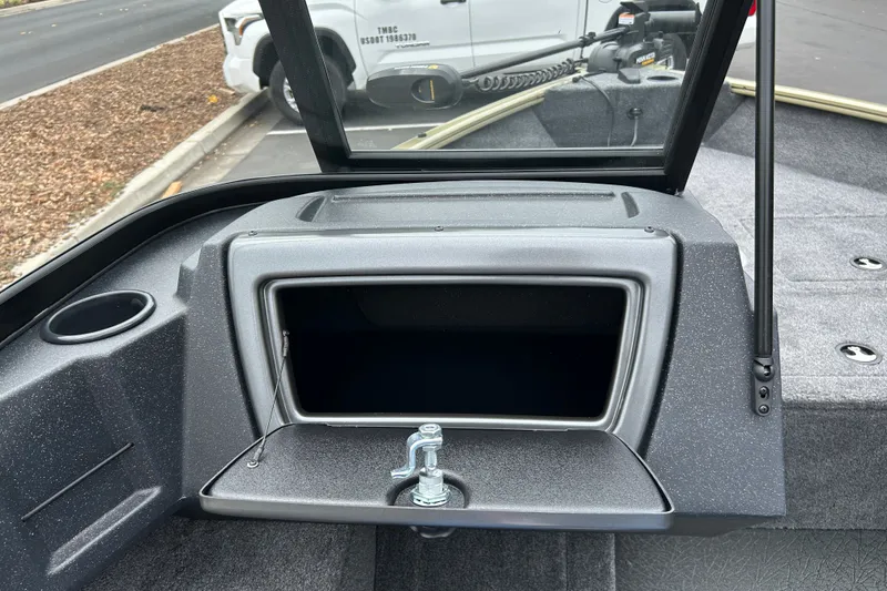 Slide: The Image of 2027 Tracker Pro Guide V-16 WT boat interior with open storage compartment. - 24