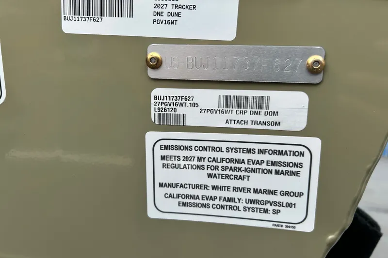 Slide: The Image of 2027 Tracker Pro Guide V-16 WT emissions control and identification labels on boat transom. - 65