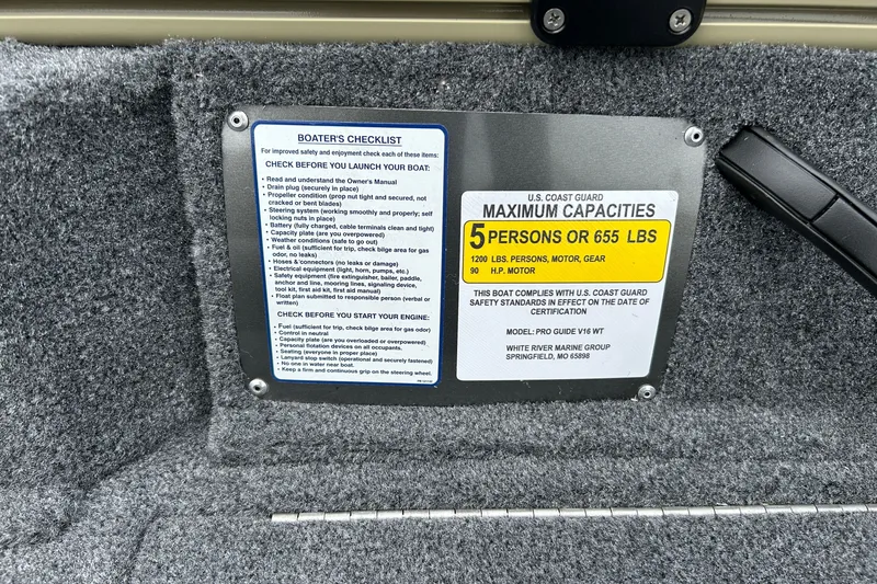 Slide: The Image of 2027 Tracker Pro Guide V-16 WT boat capacity and safety checklist label. - 22