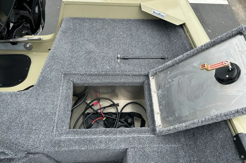 Slide: The Image of Open storage compartment in 2027 Tracker Pro Guide V-16 WT boat, showing cables and interior. - 31
