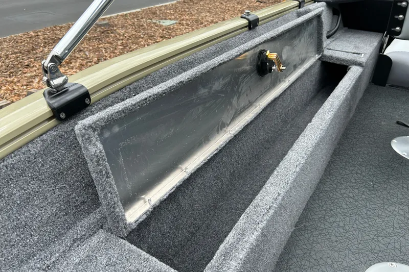 Slide: The Image of Interior view of 2027 Tracker Pro Guide V-16 WT boat, featuring storage compartment. - 20