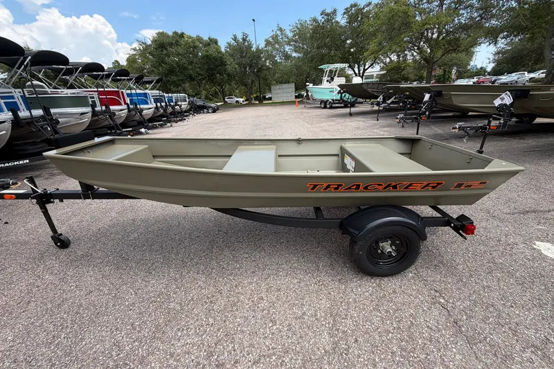 The Image of 2027 Tracker Grizzly 12 Jon boat on trailer in outdoor showroom. - 0