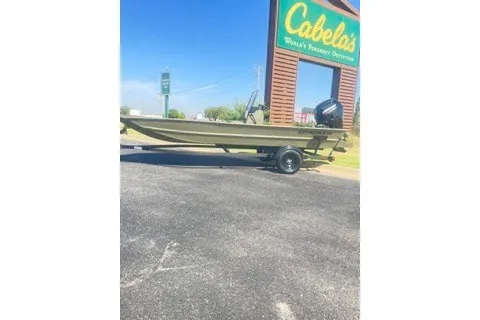 The Image of 2027 Tracker Grizzly 1860 CC boat displayed outside Cabela's store. - 0