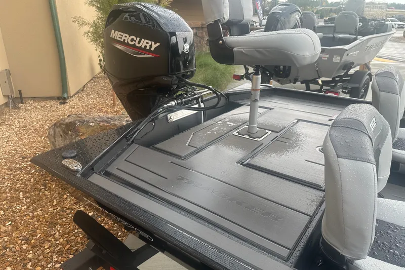 Slide: The Image of 2027 Tracker Pro 170 boat with Mercury engine, wet deck, and cushioned seats. - 32