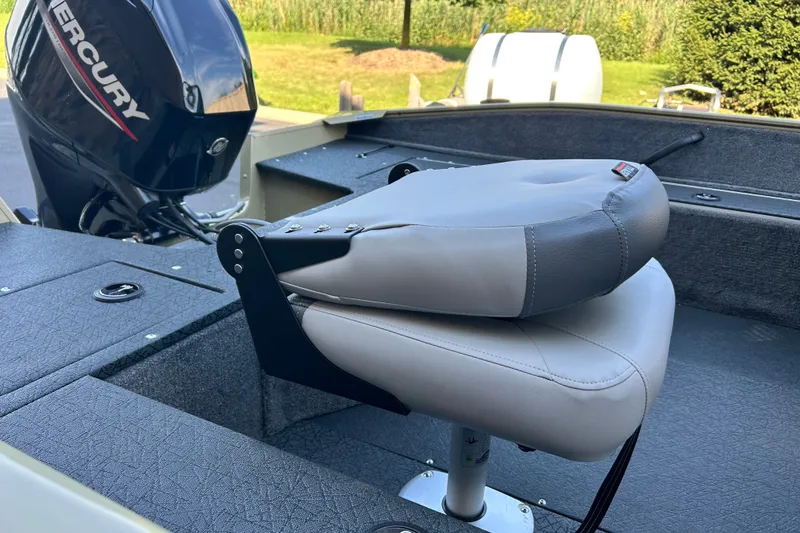 Slide: The Image of 2027 Tracker Pro Guide V-16 WT boat interior with Mercury engine and cushioned seat. - 48