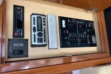 Slide: The Image of Control panel of a 2008 Sea Ray Sundancer 310 boat, featuring various electronic systems. - 13