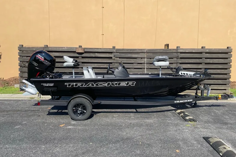 The Image of 2027 Tracker Pro Team 195 boat on trailer, parked outdoors. - 0