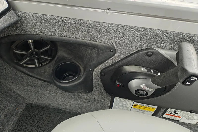 Slide: The Image of Interior of 2027 Tracker Targa V-18 Combo boat with speaker, cup holder, and control lever. - 31