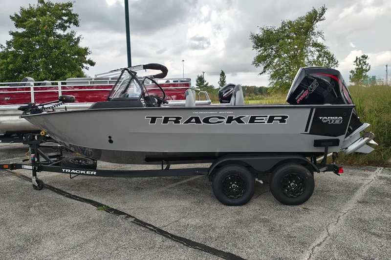 The Image of 2027 Tracker Targa V-18 Combo boat on trailer, parked outdoors. - 1