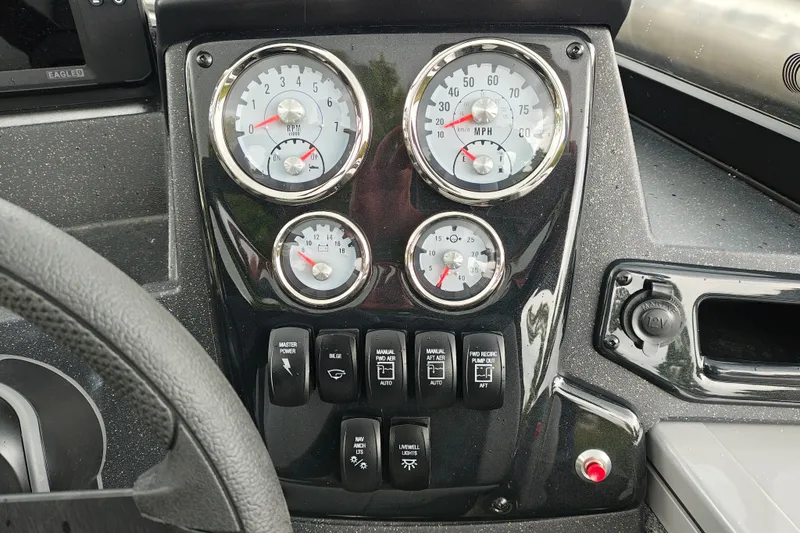 Slide: The Image of Dashboard of 2027 Tracker Targa V-18 Combo with gauges and control switches. - 29