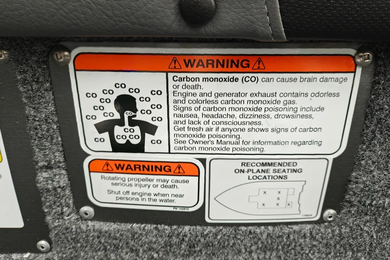 Slide: The Image of Warning label on 2027 Tracker Targa V-18 Combo about carbon monoxide and propeller safety. - 32
