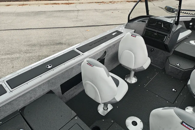 Slide: The Image of 2027 Tracker Targa V-18 Combo boat interior with seating and dashboard. - 27