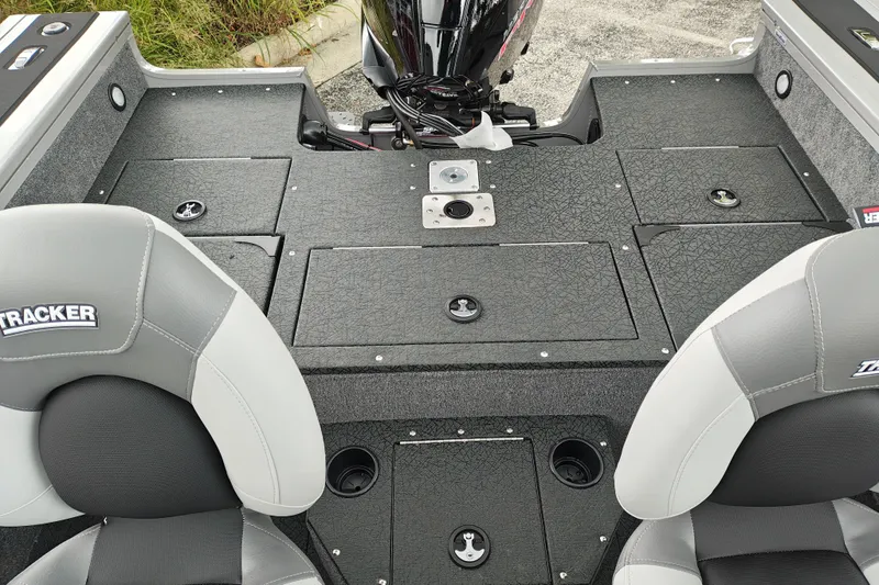 Slide: The Image of 2027 Tracker Targa V-18 Combo boat interior with seating and storage compartments. - 16