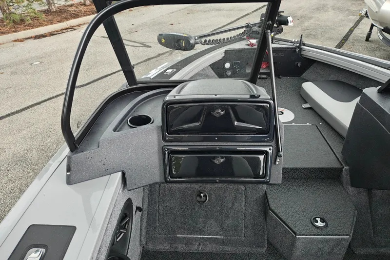 Slide: The Image of Interior view of a 2027 Tracker Targa V-18 Combo boat, showcasing seating and storage compartments. - 34