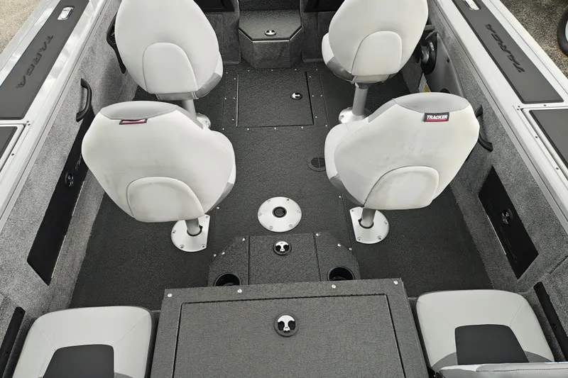 Slide: The Image of Interior of 2027 Tracker Targa V-18 Combo boat with four seats and storage compartments. - 22
