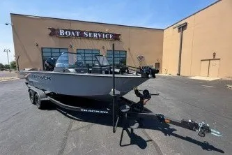 The Image of 2027 Tracker Targa V-18 Combo boat on trailer outside service center. - 0