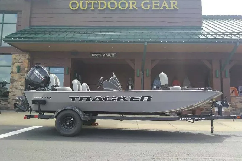 The Image of 2027 Tracker Pro 170 boat on trailer outside outdoor gear store. - 0