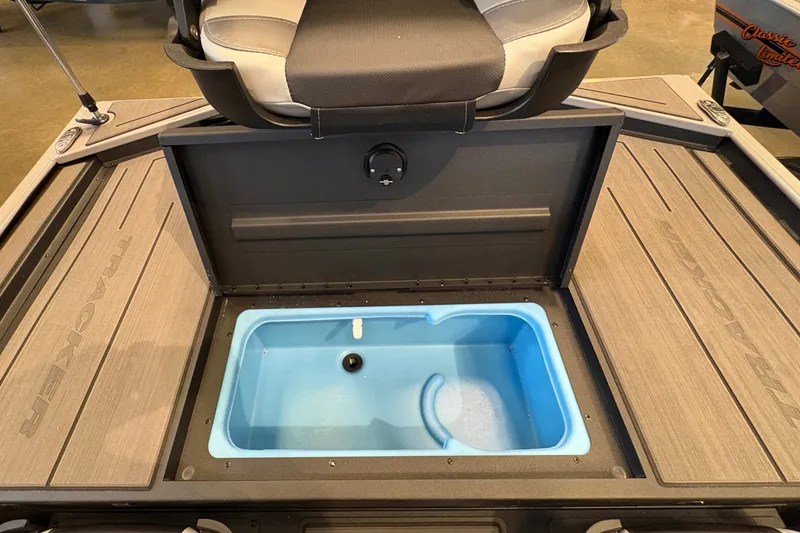 Slide: The Image of The image shows the interior of a Tracker Pro 170 boat with a blue livewell. - 13
