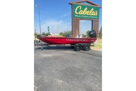 The Image of 2027 Tracker Pro Team 195 boat in front of Cabela's store. - 0
