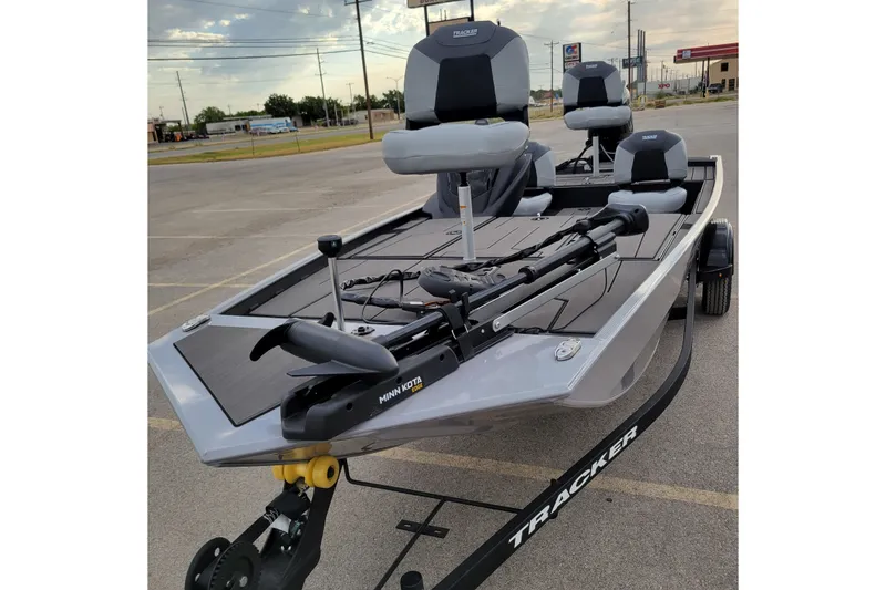 The Image of 2027 Tracker Pro 170 boat with Minn Kota trolling motor in parking lot. - 0