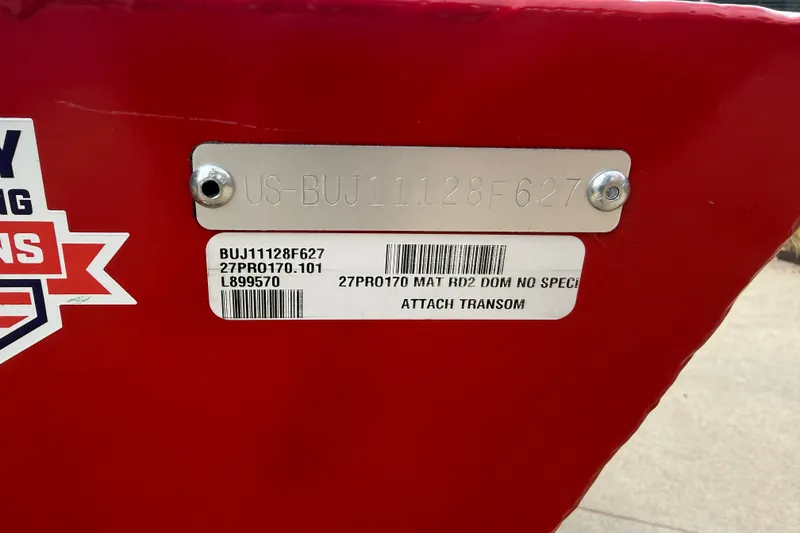 Slide: The Image of Red Tracker Pro 170 boat, model year 2027, with identification plate and barcode. - 13