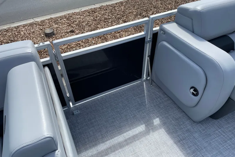 Slide: The Image of 2027 Sun Tracker SportFish 22 DLX boat interior with gray seating and flooring. - 23