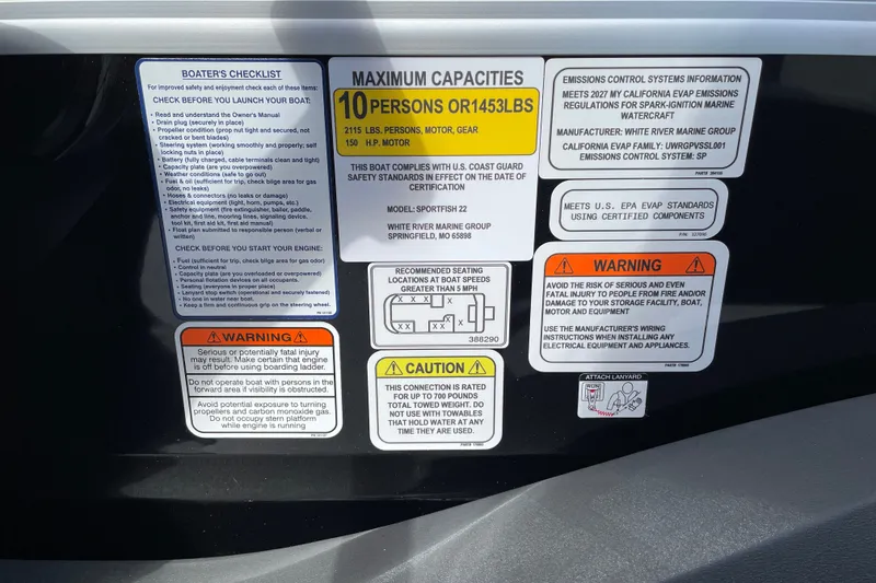 Slide: The Image of Safety and capacity labels on 2027 Sun Tracker SportFish 22 DLX boat. - 27