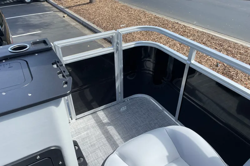 Slide: The Image of 2027 Sun Tracker SportFish 22 DLX boat interior with seating and railing. - 19