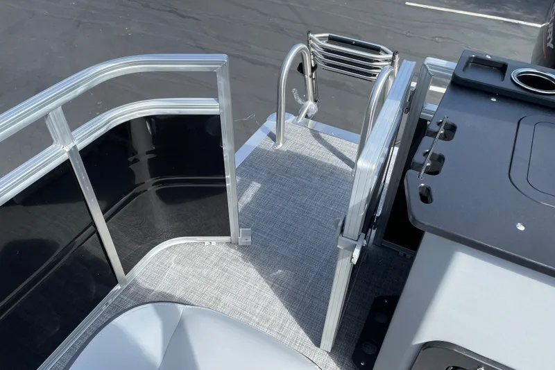 Slide: The Image of 2027 Sun Tracker SportFish 22 DLX boat interior with ladder and seating area. - 21