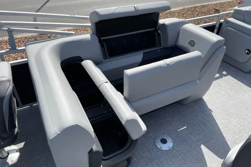 Slide: The Image of 2027 Sun Tracker SportFish 22 DLX boat interior with gray seating and storage compartments. - 13