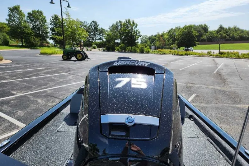 Slide: The Image of 2027 Tracker Pro Team 195 with Mercury 75 engine in a parking lot. - 42