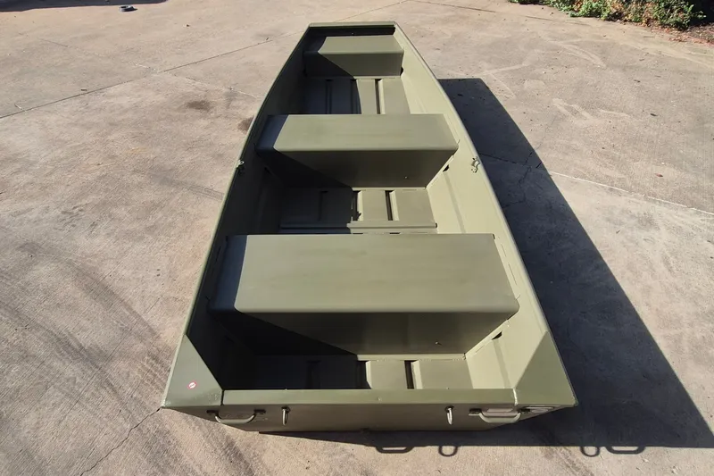 The Image of 2027 Tracker Grizzly 12 Jon boat on concrete surface, showcasing its sturdy design. - 0