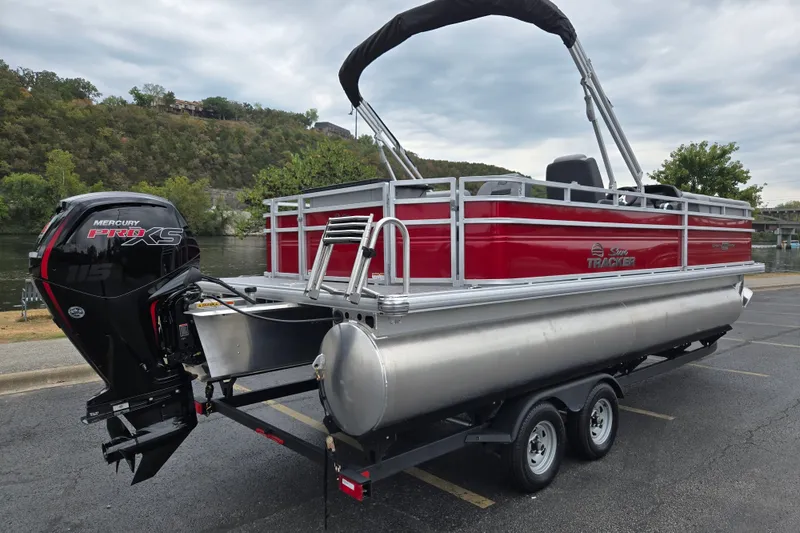 Slide: The Image of 2027 Sun Tracker SportFish 22 DLX pontoon boat with Mercury Pro XS engine on trailer. - 18