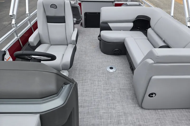 Slide: The Image of 2027 Sun Tracker SportFish 22 DLX interior with gray seating and steering console. - 13