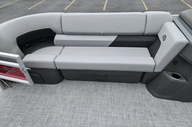 Slide: The Image of 2027 Sun Tracker SportFish 22 DLX boat interior with gray cushioned seating and cup holders. - 14