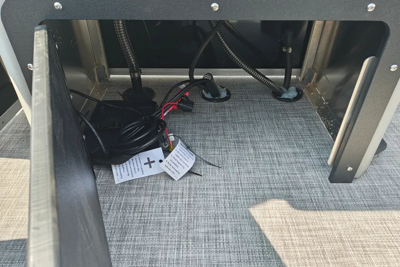 Slide: The Image of Interior view of 2027 Sun Tracker SportFish 22 DLX boat wiring and components. - 24