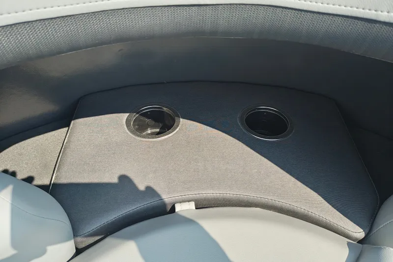 Slide: The Image of Interior of 2027 Sun Tracker SportFish 22 DLX boat with dual cup holders. - 31