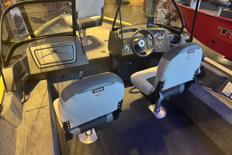 Slide: The Image of Interior of 2027 Tracker Pro Guide V-16 WT boat with dual seats and dashboard. - 13